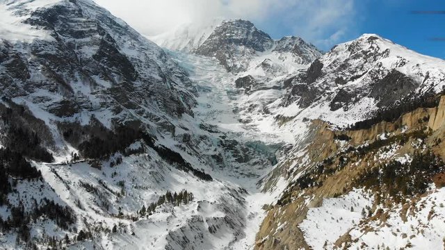 Aerial closing in shot of the huge glacier between Annapurna three and Gangapurna Himalaya Mountains in the Manang Valley, Nepal.
