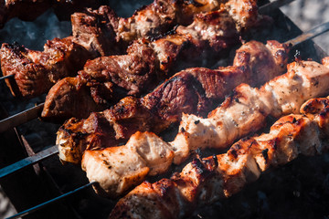 Barbecue. Meat. Grill. Roasting. Fire. Cooking kebab. Meat background.