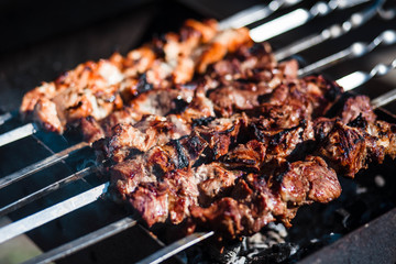 Barbecue. Meat. Grill. Roasting. Fire. Cooking kebab. Meat background.