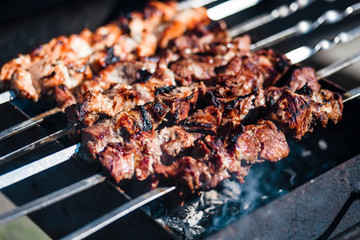 Barbecue. Meat. Grill. Roasting. Fire. Cooking kebab. Meat background.