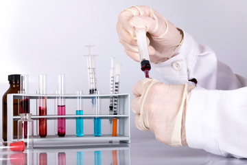 doctor while analyzing a flu vaccine