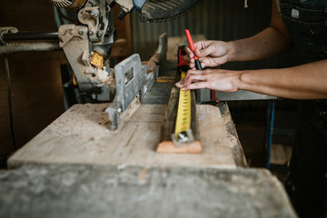Carpenter measuring wood
