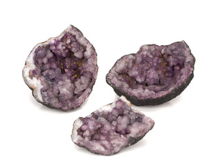 Amethyst crystals close-up on a white background