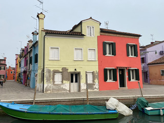 Fototapeta na wymiar Island murano in Venice Italy. View on canal with boat and motorboat water