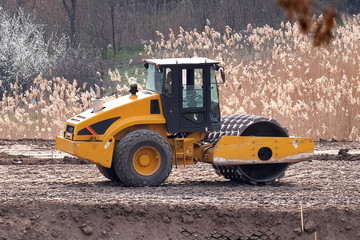 Fototapeta premium Soil skating rink working to sealing ground the base of road. Construction Heavy Industrial Machine Road roller Build a New Highway