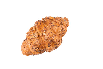 Photo of fresh golden croissants covered sunflower seeds and sesame isolated on white background. Top view.