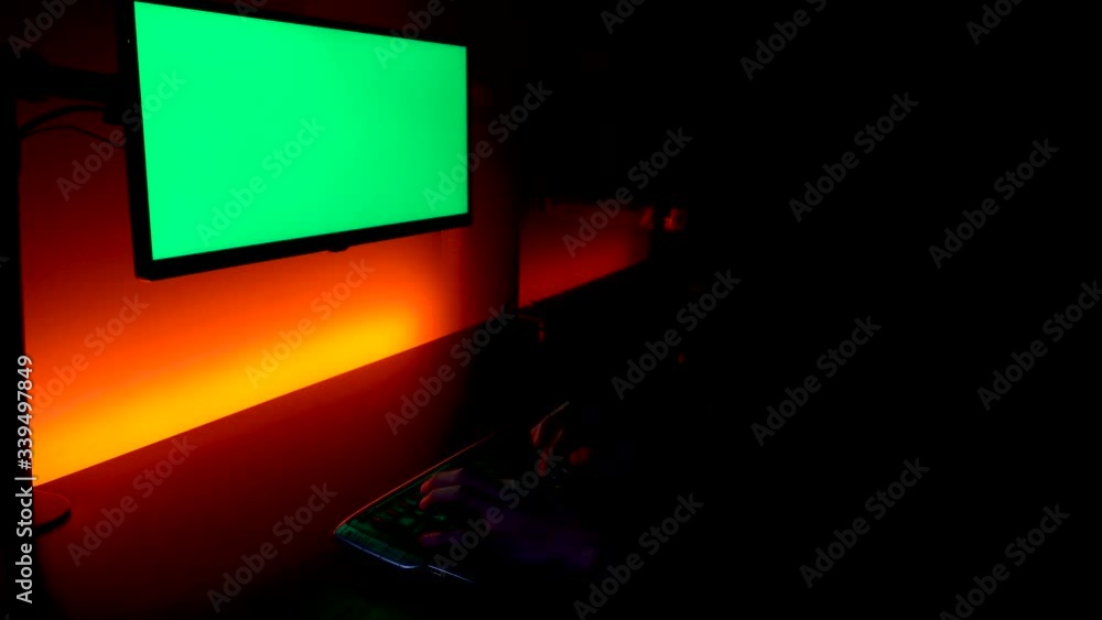 Poster green screen: caucasian hands typing on a keyboard with monitor display above