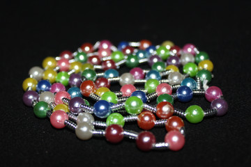 row of colorful Pearl strings abstract background