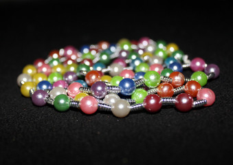 row of colorful Pearl strings abstract background