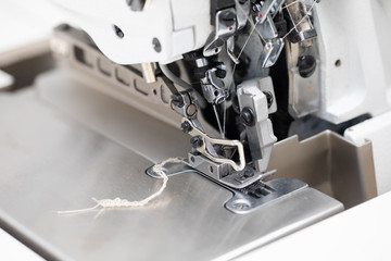 Industrial 4-thread overlock sewing machine for tailor's shop.