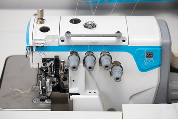 Industrial 4-thread overlock sewing machine for tailor's shop.