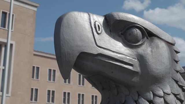 Beautiful eagle head statue at Berlin city airport during the day with blue sky