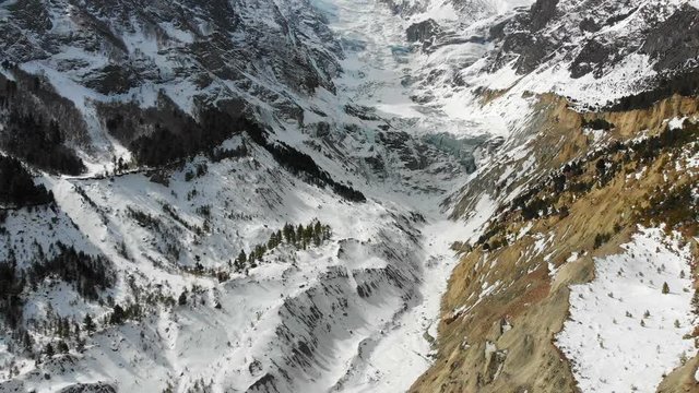 Aerial panning down shot of the huge glacier between Annapurna three and Gangapurna Himalaya Mountains in the Manang Valley, Nepal.