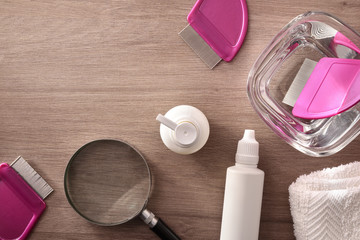 Lice removal equipment with products and accessories on wooden table