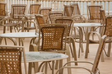 empty tables and chairs in a cafe. No people. Concepts - Stay at home, save live, self-isolation. Coronavirus Pandemic lifestyles
