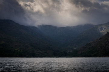 Landscape of mountain range under cloudy sky