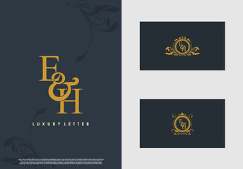 EH logo initial vector mark. Gold color elegant classical symmetric curves decor.