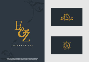 EZ logo initial vector mark. Gold color elegant classical symmetric curves decor.