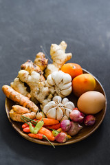 Basic seasoning ingredients in a wooden plate.