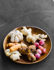 Basic seasoning ingredients in a wooden plate.