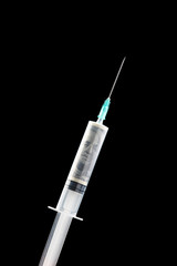 Closeup photo of syringe with money dollars inside isolated on black background