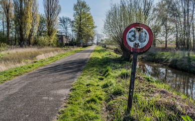 Weathered road sign on a deserted backroad