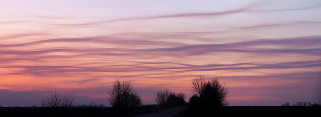 evening country road and infernal clouds