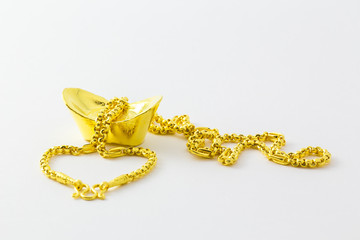 ฺGold necklace in Red box on white background. Greeting cards for good luck and happiness in the Chinese New Year.