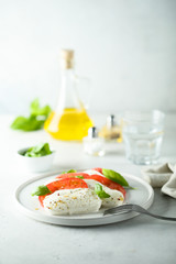 Homemade Caprese salad with tomato, mozzarella and basil