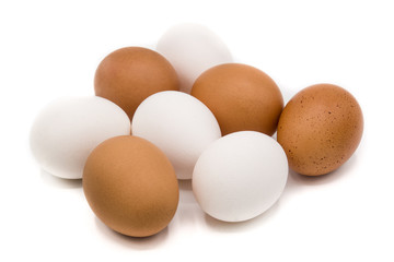 Brown and white eggs isolated on white background