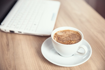cup of coffee with computer