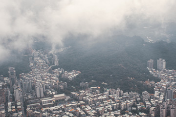 The view across Taipei, captial of Taiwan, from the top of Taipei 101, the second largest building in the world,shoot after raining with fog.