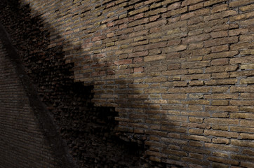 View in perspective of an old brick wall with directional lights background