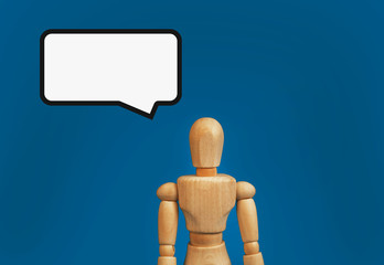 wooden figure on a blue background with a cloud template for text