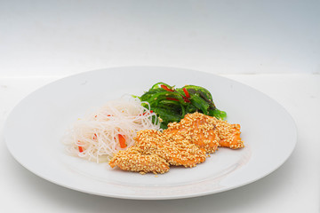 fish grilled in sesame with glass noodles and chuka salad