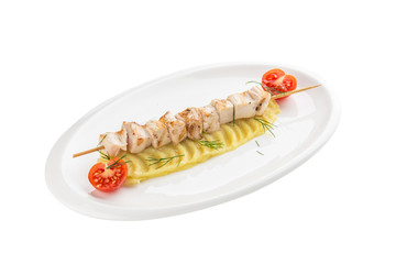 Homemade chicken Kofta kebabs on skewers with mashed potato and cherry tomato isolated on white background