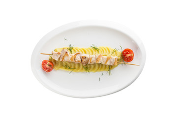 Homemade chicken Kofta kebabs on skewers with mashed potato and cherry tomato isolated on white background