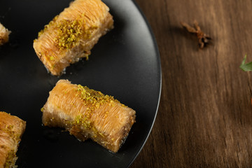 Turkish delight pakhlava served with minced pistacchio, top view