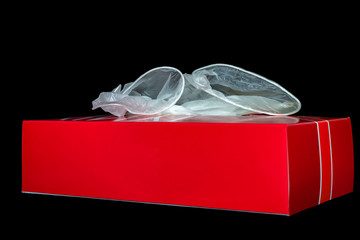 Close up on vinyl glove in paper box in black background. Personal Protective Equipment.