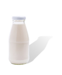 Glass bottle of almond milk  isolated on white background