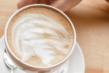 Coffee ground in hands, latte, cappuccino