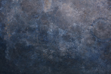 Rust and oxidized metal background. Old metal iron panel. Vintage abstract background with dim gray, dark gray and  dark blue, brown colors and space for text or image.