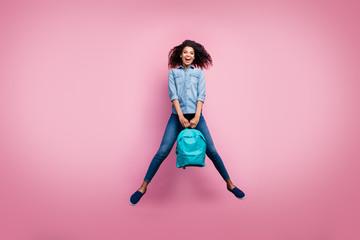 Fototapeta na wymiar Full body photo of excited funky afro american girl rest relax after college study hold bag wear casual style sneakers isolated over pink color background