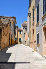 Fototapeta na wymiar Alcudia, Mallorca, Spain. Alcudia Old Town medieval street and buildings