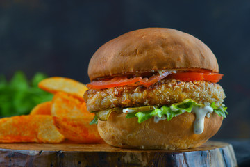 hamburger with chicken cutlet and tomatoes