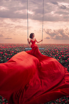 Beautiful woman in tulips field