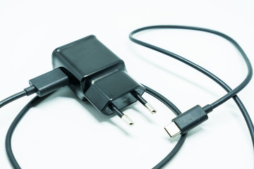 Smartphone charger with USB cable, isolated on white background