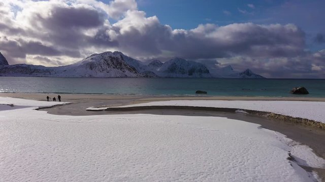 Haukland Beach, Creek and Mountains. Lofoten Islands, Norwegian Sea, Norway. Aerial View. Drone Flies Forward