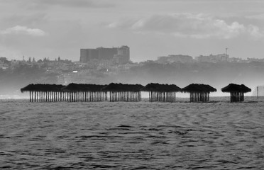 Closed beach in the Algarve because of the coronavirus. Umbrellas cast shadows, but not a single guest.