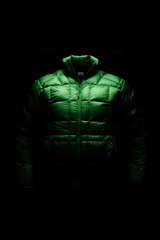 Green down jacket in static position with ghost effect and black background